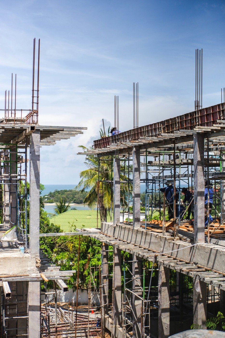 Workers assembling a concrete structure on a construction site