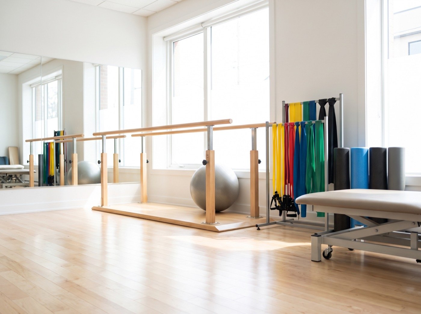 Parallel bars, resistance bands and foam rollers in a rehab gym