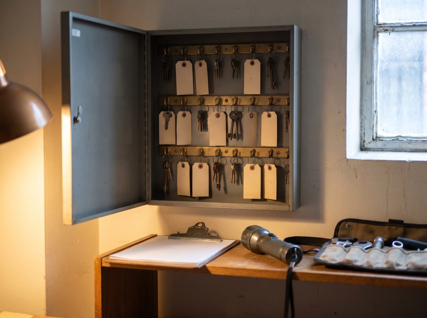 Rows of keys with blank tags in a steel key cabinet
