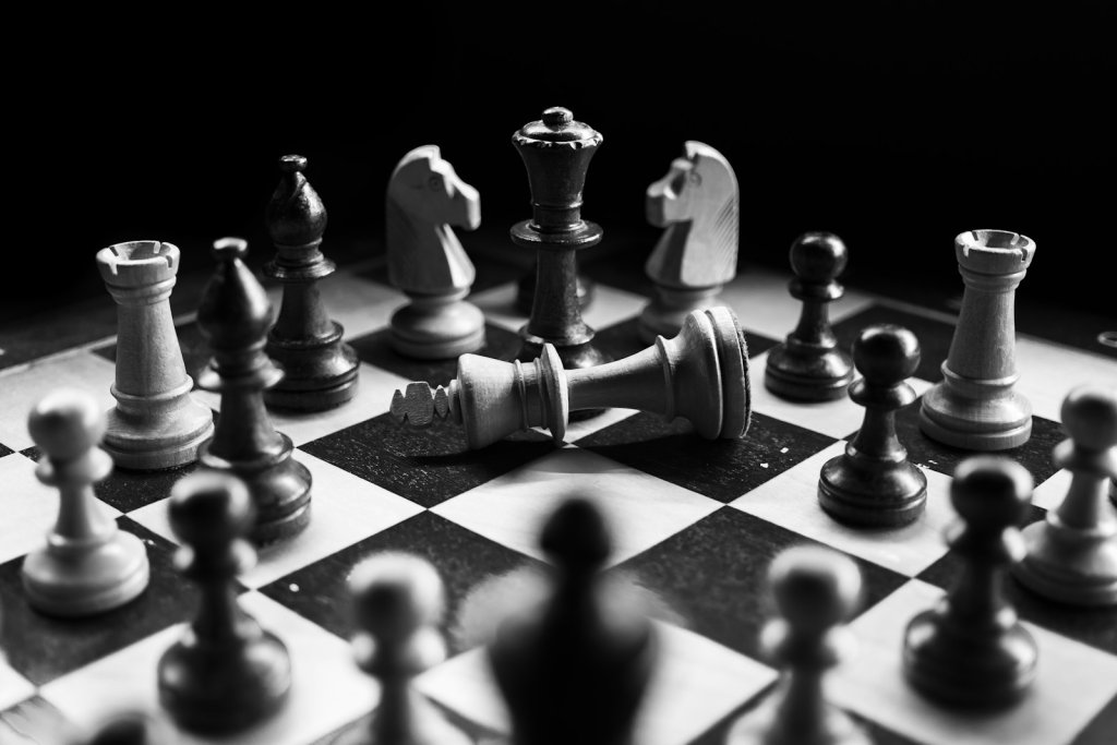 Chess pieces strategically placed on a wooden board — illustrating keyword conflict and strategy